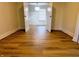 Spacious bedroom featuring laminate wood floor, neutral walls, and a modern ceiling light at 212 S Good Ave, Indianapolis, IN 46219