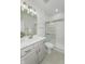 Well-lit bathroom with walk-in shower, modern fixtures, gray vanity, and plenty of vanity top space at 2639 Collins Dr, Westfield, IN 46074