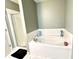 This is a bathroom with a tile surround bath tub, and a glass enclosed shower at 5778 W Commonview Dr, McCordsville, IN 46055