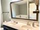 This is a bathroom with double sinks, and a vanity with a dark finish and bright walls at 5778 W Commonview Dr, McCordsville, IN 46055