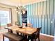 An inviting dining room with a unique light fixture and contemporary decor at 5778 W Commonview Dr, McCordsville, IN 46055