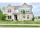 Charming two-story brick home featuring a well-manicured lawn and a welcoming entrance at 5778 W Commonview Dr, McCordsville, IN 46055