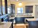 Modern kitchen features stainless steel appliances, granite countertops and stylish backsplash at 5778 W Commonview Dr, McCordsville, IN 46055
