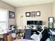 This is an office featuring a desk, computer and office chair with lots of natural light at 5778 W Commonview Dr, McCordsville, IN 46055