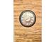 Decorative clock hung over wood textured wall at 5778 W Commonview Dr, McCordsville, IN 46055