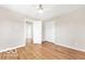This bedroom features hardwood floors, neutral paint, and a ceiling fan at 839 Fernwood Ct, Indianapolis, IN 46234