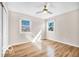 This bedroom boasts hardwood floors, natural light, and a modern ceiling fan at 839 Fernwood Ct, Indianapolis, IN 46234
