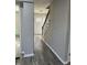 Inviting foyer with wood-look flooring and a staircase leading to the upper level at 839 Fernwood Ct, Indianapolis, IN 46234