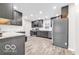 Modern kitchen with stainless steel appliances, sleek cabinetry, and ample counter space at 839 Fernwood Ct, Indianapolis, IN 46234