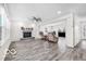 Bright living room featuring a fireplace and seamless flow into additional spaces at 839 Fernwood Ct, Indianapolis, IN 46234