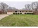 Inviting single-story house featuring a manicured lawn and attached garage at 104 Mohawk Ln, West Lafayette, IN 47906
