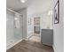 Bright bathroom featuring a glass shower, stylish vanity, and a large soaking tub at 1775 Beyers St, Fortville, IN 46040