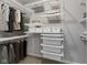 This walk-in closet features ample shelving and hanging storage for organization at 1775 Beyers St, Fortville, IN 46040