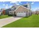 Charming two-story home with a brick and siding exterior, complemented by a well-kept lawn at 1775 Beyers St, Fortville, IN 46040