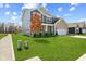 Beautiful two-story home with a well-manicured lawn and inviting curb appeal in a suburban neighborhood at 1775 Beyers St, Fortville, IN 46040