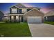 Beautiful two-story home with manicured lawn and a two-car garage at 1775 Beyers St, Fortville, IN 46040