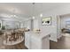 Open concept kitchen with a large island, dining area and views into the living room at 1775 Beyers St, Fortville, IN 46040