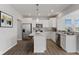 Bright kitchen with white cabinets, stainless steel appliances and a large island at 1775 Beyers St, Fortville, IN 46040