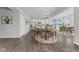Open concept dining area and kitchen featuring modern appliances, pendant lighting, and hardwood floors throughout at 1775 Beyers St, Fortville, IN 46040