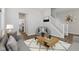 Cozy living room with gray furniture, wood floors and a staircase at 1775 Beyers St, Fortville, IN 46040