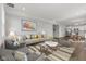 Spacious living room with a large sofa, stylish armchairs, a decorative rug, and an open floor plan at 1775 Beyers St, Fortville, IN 46040