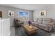 Cozy upstairs living room with plush furniture, an accent rug, and a bright window at 1775 Beyers St, Fortville, IN 46040