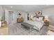 Spacious main bedroom with a plush bed, a stylish accent rug, and a cozy seating area at 1775 Beyers St, Fortville, IN 46040