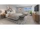 Tranquil main bedroom featuring a plush bed, neutral decor, and natural light from a bright window at 1775 Beyers St, Fortville, IN 46040