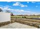New construction backyard features a pond and clear view of the distant treeline at 18322 Depoe Ln, Westfield, IN 46074