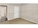 Neutral bedroom offers cozy carpeting, paneled door, and easy access to the bathroom at 18322 Depoe Ln, Westfield, IN 46074