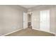 Neutral bedroom offers cozy carpeting, easy access to the entry and paneled door at 18322 Depoe Ln, Westfield, IN 46074