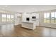 Open-concept kitchen featuring white cabinetry, an island, and stainless steel appliances at 18322 Depoe Ln, Westfield, IN 46074