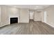 Spacious living room showcasing hardwood floors, a fireplace, and modern recessed lighting at 18322 Depoe Ln, Westfield, IN 46074