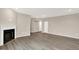 Expansive living room featuring hardwood floors and a cozy fireplace at 18322 Depoe Ln, Westfield, IN 46074