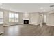 Inviting living room with hardwood floors, a fireplace, and an abundance of natural light at 18322 Depoe Ln, Westfield, IN 46074