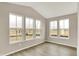 Bright sunroom with large windows offering picturesque views of the neighborhood and pond at 18322 Depoe Ln, Westfield, IN 46074
