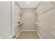 Large walk-in closet featuring carpet flooring and ample shelving for storage at 18322 Depoe Ln, Westfield, IN 46074