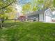 Fenced yard with patio seating area and a well-maintained lawn at 104 W County Road 500 S, Clayton, IN 46118