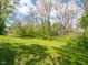 View of backyard with fire pit and surrounding trees at 104 W County Road 500 S, Clayton, IN 46118