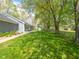 A large backyard with lush green grass and tree coverage at 104 W County Road 500 S, Clayton, IN 46118