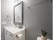 Bathroom with vanity, faucet, mirror and towel rack on gray wall at 104 W County Road 500 S, Clayton, IN 46118