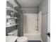 Bathroom with shelves, toilet, shower and tub combination at 104 W County Road 500 S, Clayton, IN 46118