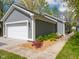 Home with an attached garage and a garden bed in front at 104 W County Road 500 S, Clayton, IN 46118
