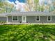 Back of a home featuring a well-manicured lawn at 104 W County Road 500 S, Clayton, IN 46118