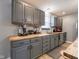 A kitchen featuring gray cabinets, butcher block countertops, and stainless steel appliances at 104 W County Road 500 S, Clayton, IN 46118