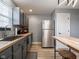 A kitchen featuring gray cabinets, butcher block countertops, and stainless steel appliances at 104 W County Road 500 S, Clayton, IN 46118
