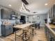 An open kitchen featuring gray cabinets, butcher block countertops, stainless appliances, and a dining area at 104 W County Road 500 S, Clayton, IN 46118