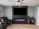 Modern living room featuring sleek entertainment center with fireplace and flat screen at 104 W County Road 500 S, Clayton, IN 46118