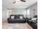 Spacious living room with hardwood floors, stylish furniture, and ample natural light at 104 W County Road 500 S, Clayton, IN 46118