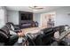 Open-concept living room featuring a sleek entertainment center, electric fireplace and comfortable seating at 104 W County Road 500 S, Clayton, IN 46118
